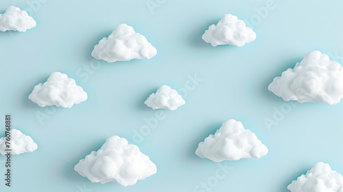 white fluffy clouds evenly distributed on pastel colored light blue background photo