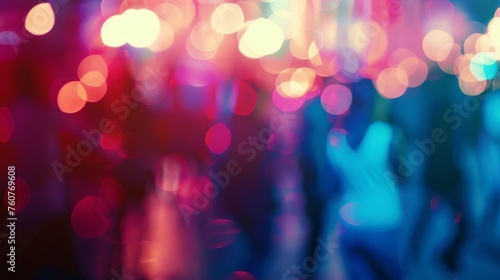 Dancing people out of focus in nightclub lights. Nightlife at party. 