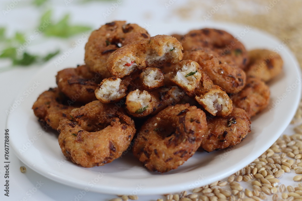 Barley Vada or fritters. Golden fried hulled barley vadas, crispy, healthy, vegetarian snack Barley Vada or fritters. Golden fried hulled barley vadas, crispy, healthy, vegetarian snack