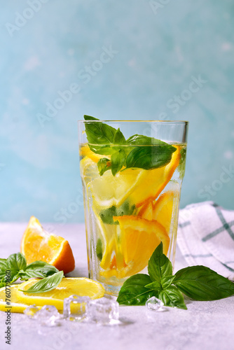 Cold summer orange lemonade with basil.