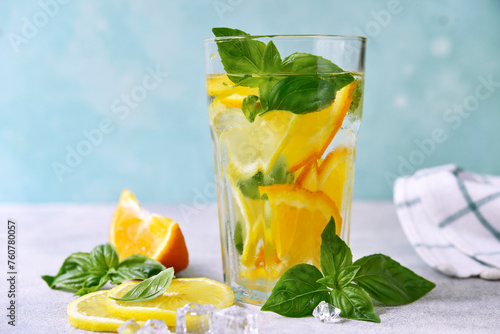 Cold summer orange lemonade with basil.