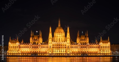 Budapest, Hungary: February 13, 2024: Parliament building at night. Time-lapse. Focus tilted to the base of the building. photo