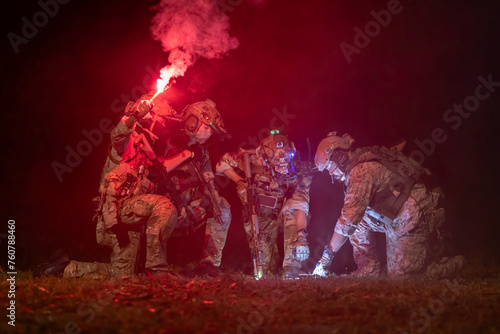 Group of solders having a discussion about the night mission © charnsitr