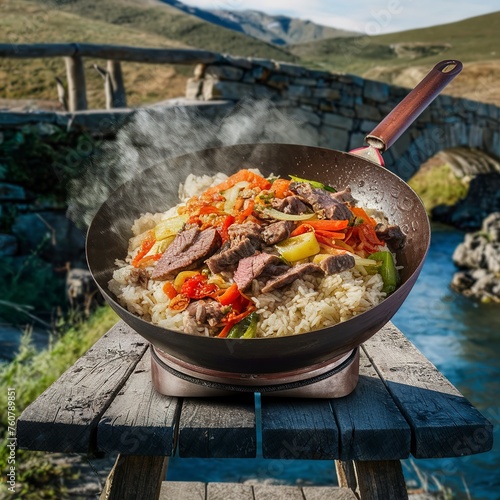 Chinese wok. Rice with beef and vegetables. On rustic background