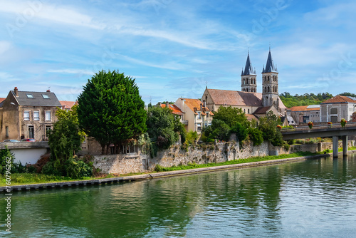 Beautiful view of the banks of the Seine River in the city of Melun and the Collegiate Church of Notre Dame. Melun, Seine-et-Marne department, France.  photo