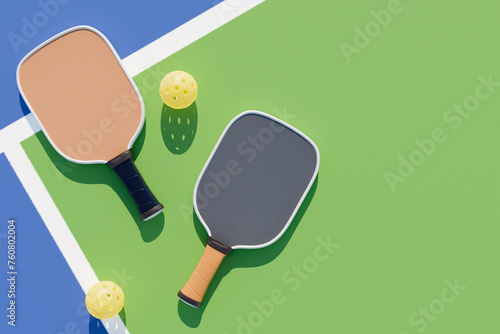 Pickleball rackets balls on the court with lines. Top view 3d rendering