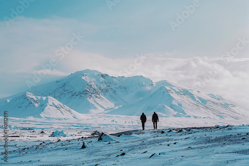 Hikers in winter on a glacier in the mountains on a partly cloudy day (ID: 760812891)