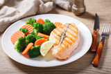plate of grilled salmon and vegetables