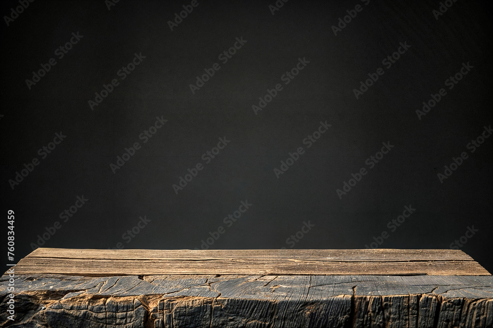 Weathered wooden tabletop with black background. Product presentation space with rustic wood texture. - obrazy, fototapety, plakaty 