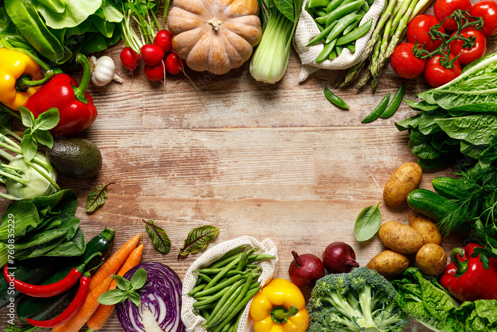 Vegetables background. Various vegetables on kitchen table. Clean eating, healthy food concept, flat lay, top down view Vegetables background. Various vegetables on kitchen table. Clean eating, healthy food concept, flat lay, top down view
