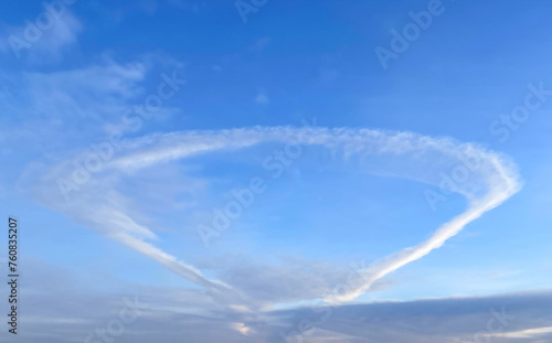 Anomalous cloud in the form of a ring in the blue sky © pridannikov