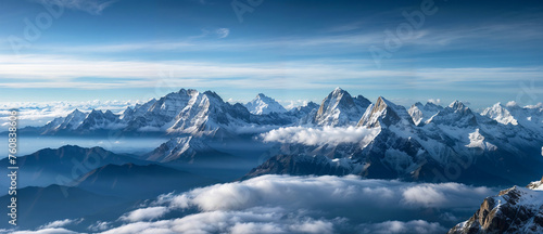 rocky mountain range piercing through a sea of clouds © AlenKadr