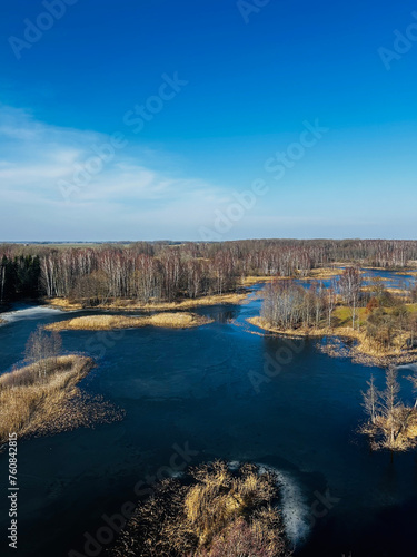 view to the lake in cold climate, winter and early spring