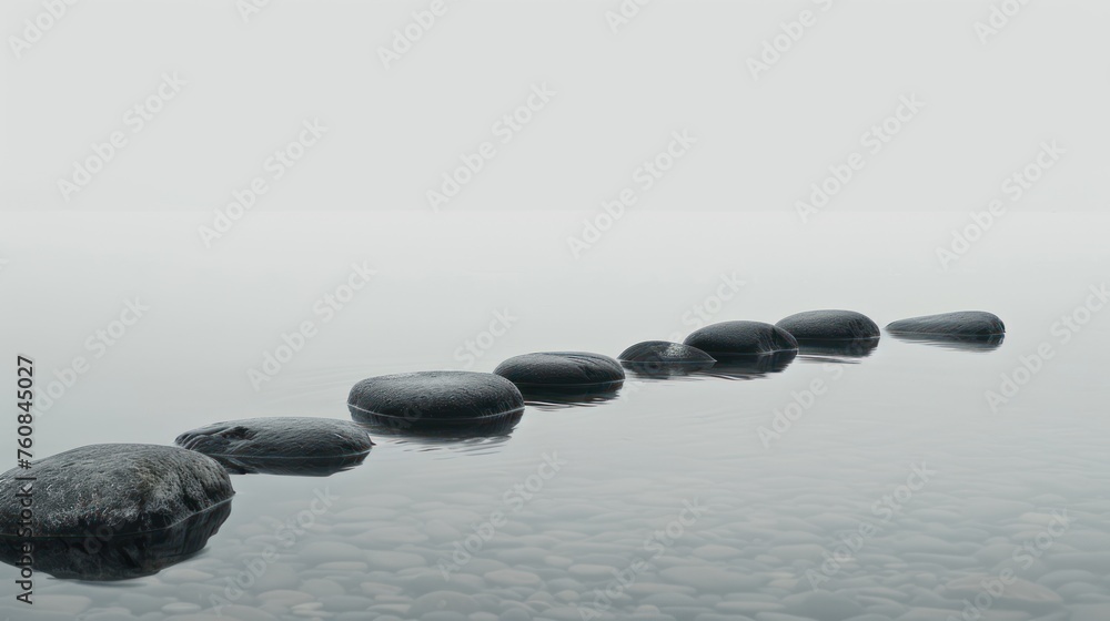 a row of rocks sitting on top of a body of water next to a row of rocks on top of a body of water.