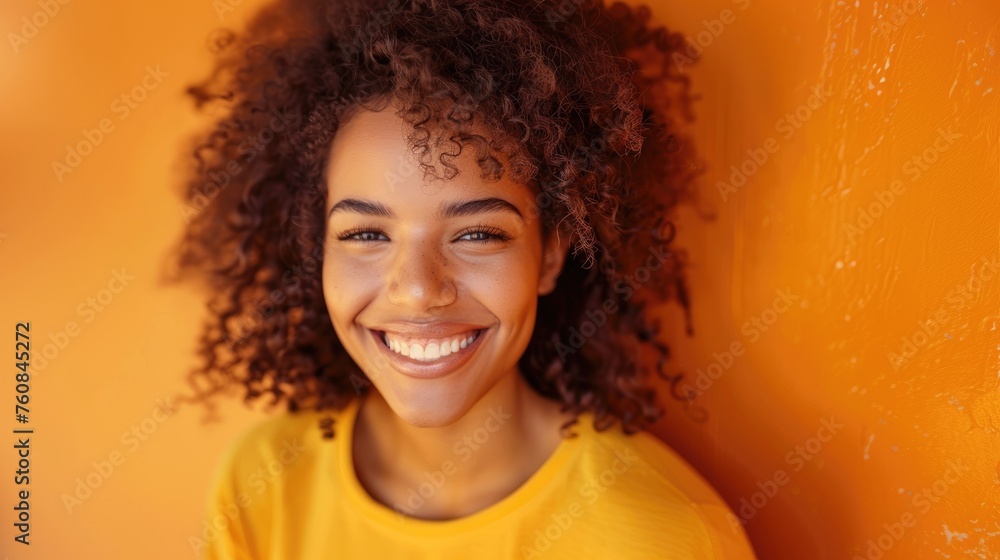 Young 20 Year Old Mixed Race Girl With Curly Hair Looking At Camera Smiling And Happy On A Vibrant Yellow Background. Generative AI. Young 20 Year Old Mixed Race Girl With Curly Hair Looking At Camera Smiling And Happy On A Vibrant Yellow Background. Generative AI.