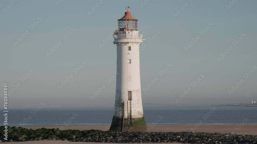 New Brighton Lighthouse at Sunrise with clear sky in background New Brighton Lighthouse at Sunrise with clear sky in background