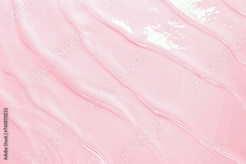 Flat lay of water surface on pastel pink background. Summer or cosmetic background photo