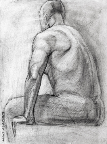 educational drawing of sitting nude male model drawn by hand by charcoal on white paper