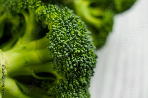 Green texture of fresh broccoli cut piece. Cooking natural vegetable meal. © Pavel Iarunichev