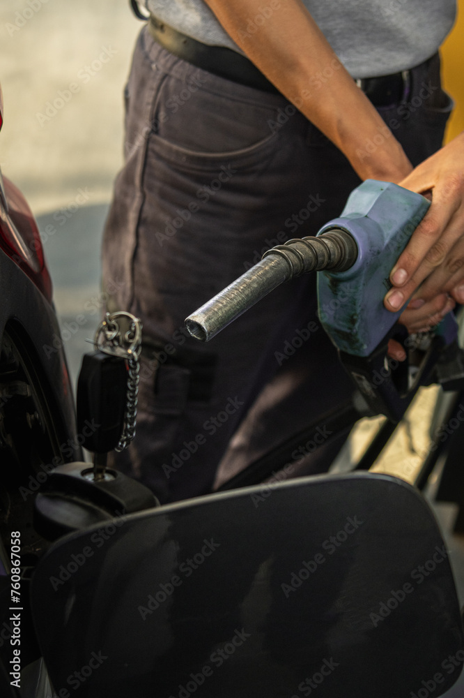 Fototapeta premium fuel pump filling gasoline or gasoline in vehicle with rising prices according to the economy