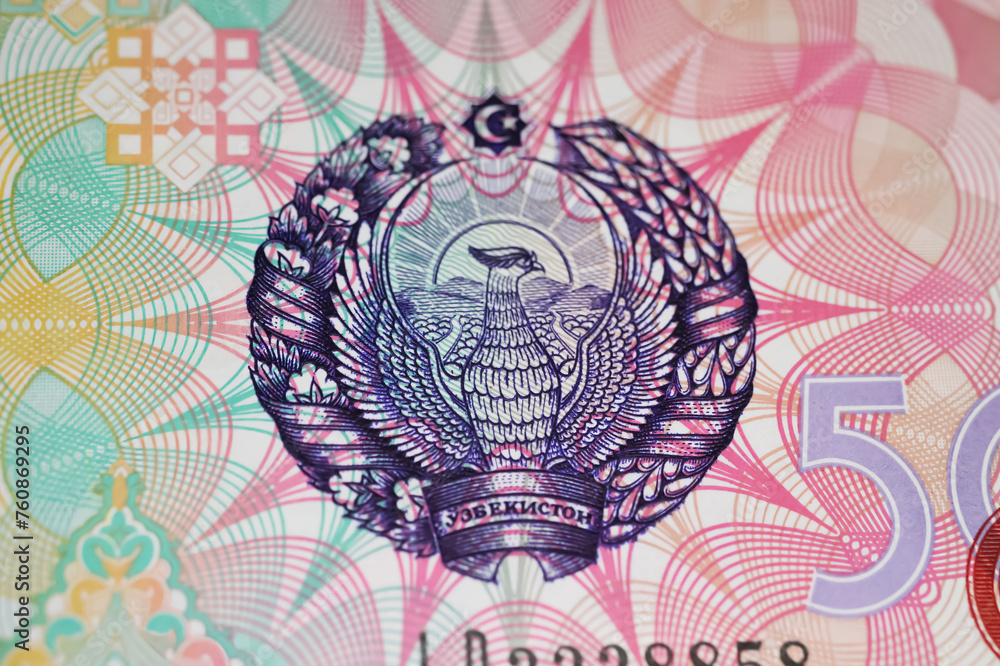 Closeup of state emblem with mythical bird Huma on Uzbekistan 500 Sum currency banknote issued 1999