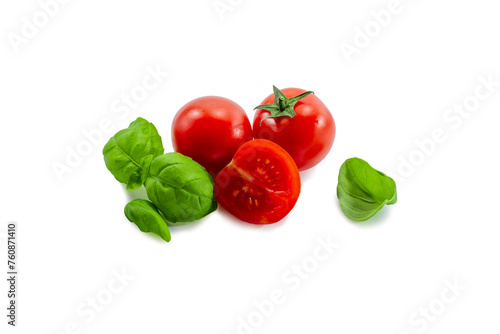 Ripe red tomato and basil on a white background isolate