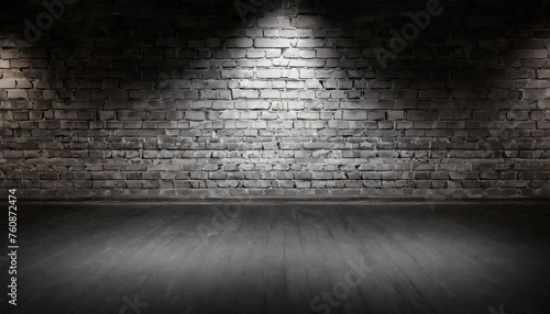 A  black brick wall with black textured background and light shining on it  for product presentation  template  banner or presentation page and web banner