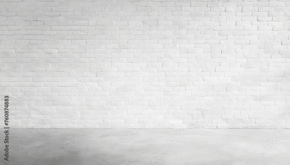 A brick wall with a large empty space in the middle. The wall is white and has a rough texture