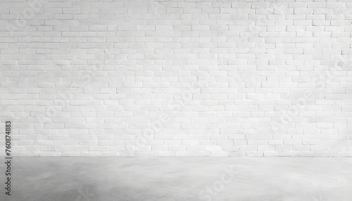 A brick wall with a large empty space in the middle. The wall is white and has a rough texture