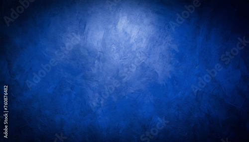 A blue texture background  blue plaster wall  with light spots of light  as a background  template  banner or page.