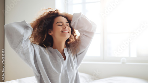 woman in state of refreshment and relaxation as she wakes from sleep