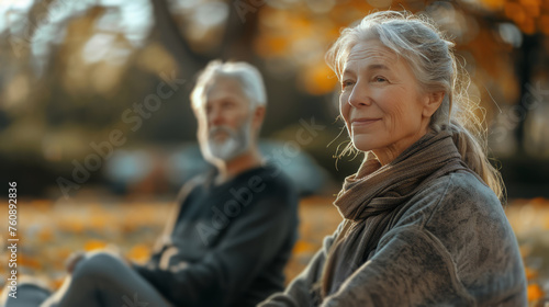 Man and Woman Sitting on Bench in Park