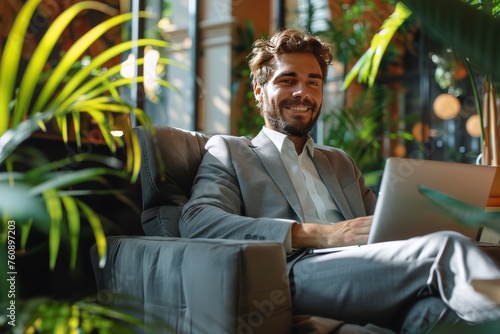 Man Working on Laptop at Desk
