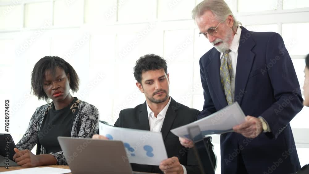 Corporate business team and manager in meeting. Diversity of business people of African and Latin women and Caucasian men are working together. Senior boss are consulting team at clean interior room. Corporate business team and manager in meeting. Diversity of business people of African and Latin women and Caucasian men are working together. Senior boss are consulting team at clean interior room.