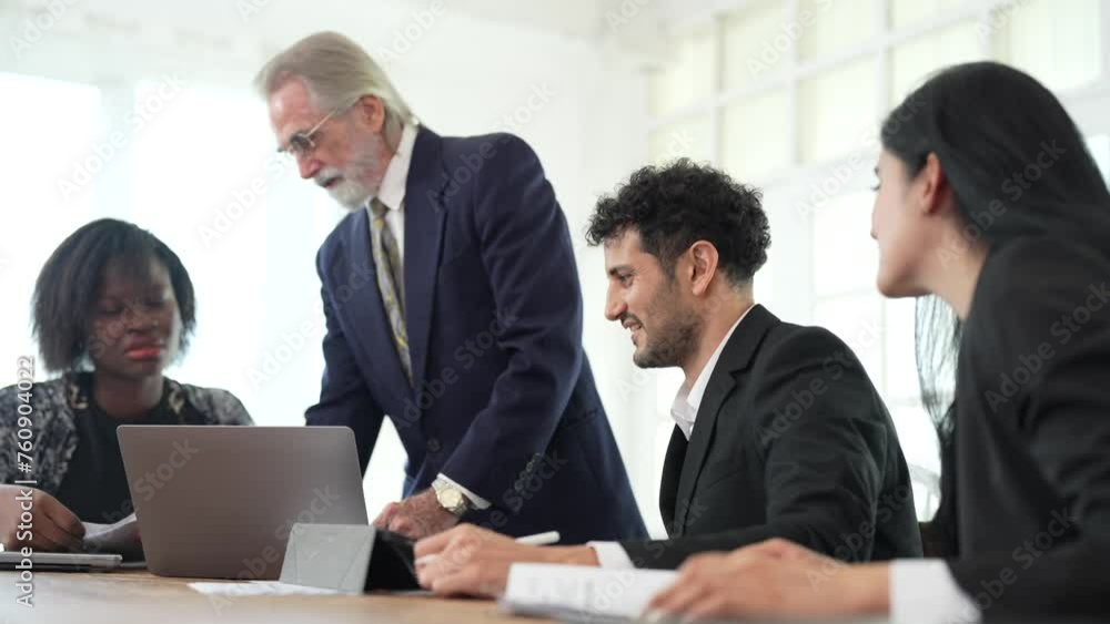 Corporate business team and manager in meeting. Diversity of business people of African and Latin women and Caucasian men are working together. Senior boss are consulting team at clean interior room. Corporate business team and manager in meeting. Diversity of business people of African and Latin women and Caucasian men are working together. Senior boss are consulting team at clean interior room.