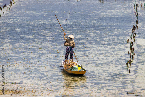 people working in seaweed farm on nusa ceningan and nusa lembongan island