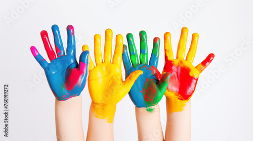 Children's Hands Covered in Colorful Paint
