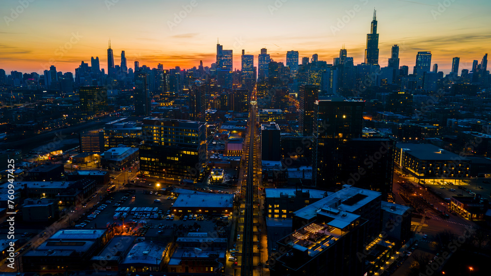 A captivating aerial view of a cityscape at dusk, showcasing illuminated skyscrapers against the darkening sky. The golden hues of sunset paint a serene backdrop, highlighting architectural marvels A captivating aerial view of a cityscape at dusk, showcasing illuminated skyscrapers against the darkening sky. The golden hues of sunset paint a serene backdrop, highlighting architectural marvels