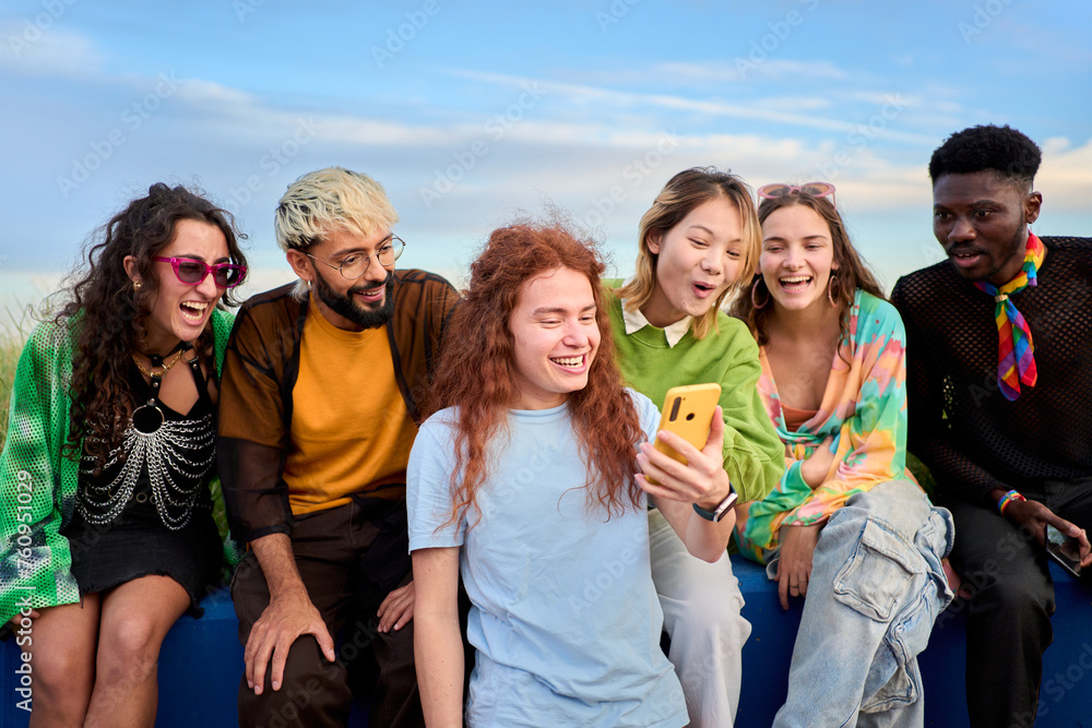 Group of young people friends using cell phones outdoors watching something funny. Concept of community millennial people addicted to technology. Social Media communication generation Z Group of young people friends using cell phones outdoors watching something funny. Concept of community millennial people addicted to technology. Social Media communication generation Z