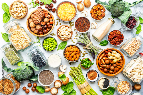 Vegan food background. Plant protein., vegetarian nutrition sources. Healthy eating, diet ingredients: legumes, beans, lentils, nuts, soy milk, tofu, cereals, seeds and sprouts. Top view