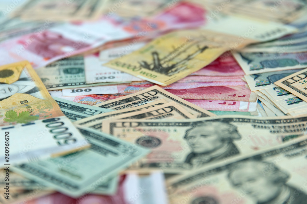 Various paper money including USD, JPY, WON, and PESO Various paper money including USD, JPY, WON, and PESO