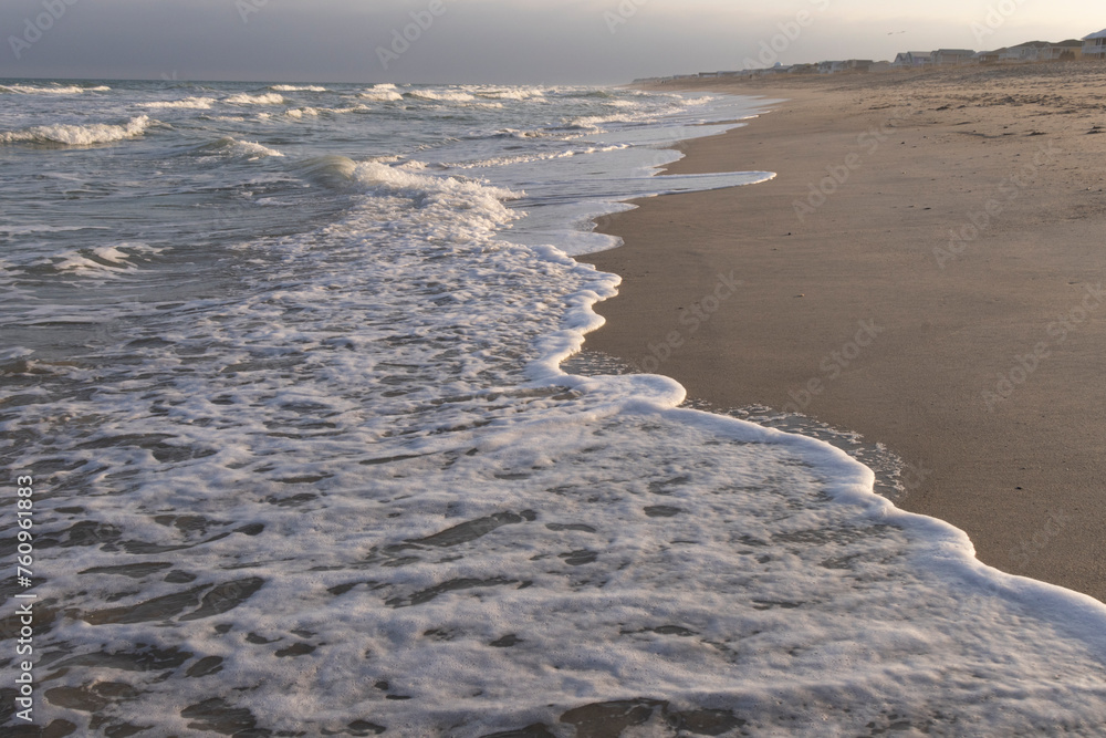 A scenic seascape view of the Atlantic ocean at Kure Beach in North Carolina. A scenic seascape view of the Atlantic ocean at Kure Beach in North Carolina.