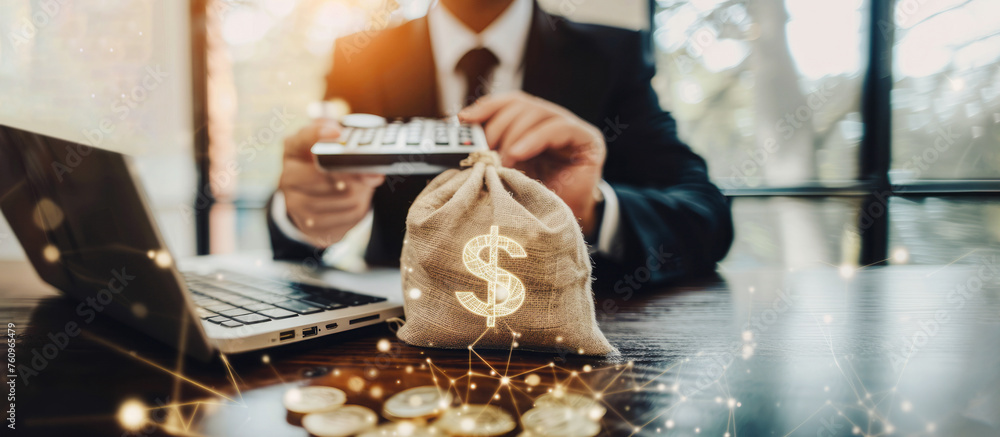 Fototapeta premium The businessman holds a money bag, representing financial planning.