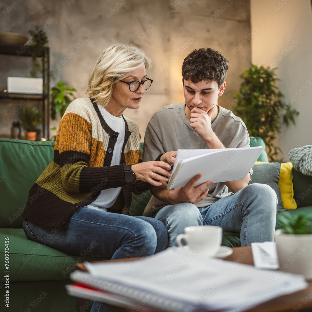 student caucasian man study with help of his tutor professor or mother student caucasian man study with help of his tutor professor or mother