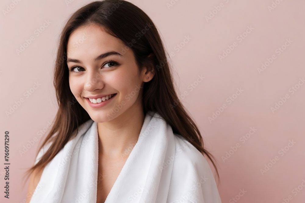 Beautiful young woman with a towel on a smooth pink background with copy space. Beautiful young woman with a towel on a smooth pink background with copy space.