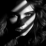 Dramatic black and white portrait with strong shadows