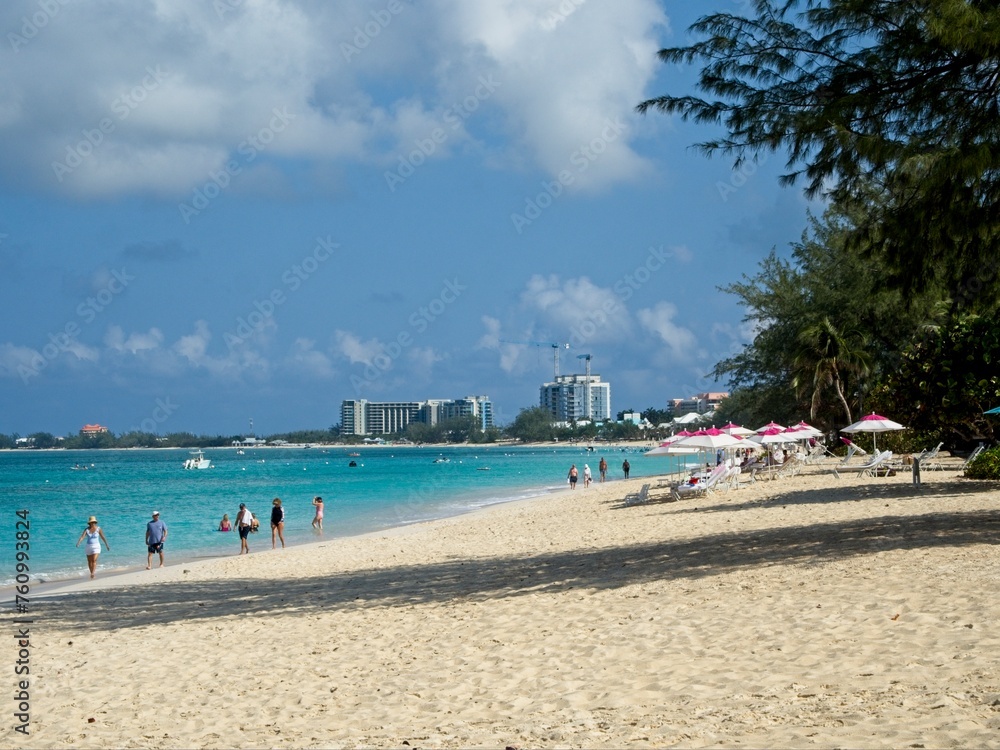 Soaking in the waves of Seven Mile Beach on Grand Cayman, Cayman Islands Soaking in the waves of Seven Mile Beach on Grand Cayman, Cayman Islands
