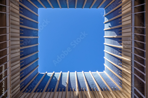 Open Skylight Above an Atrium with aClear Blue Sky. photo