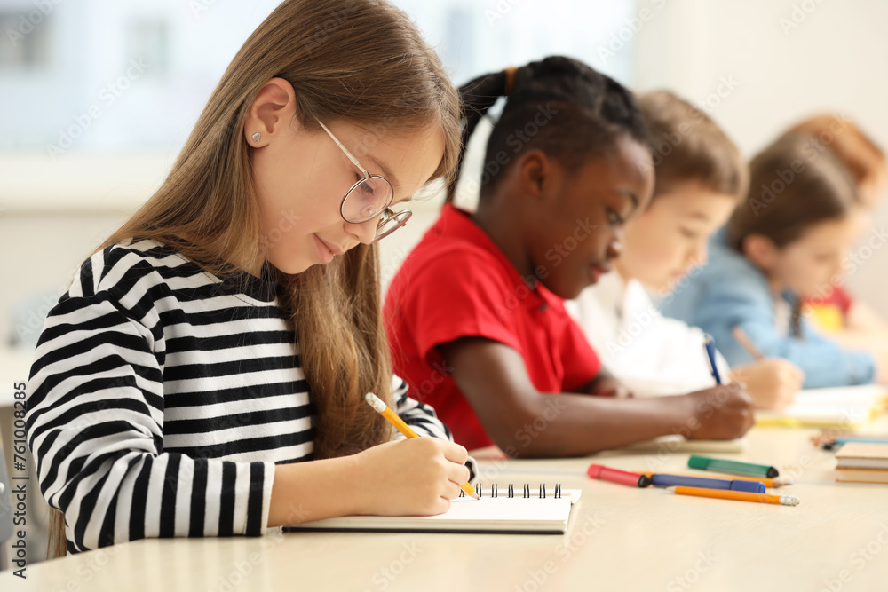 Cute children studying in classroom at school Cute children studying in classroom at school