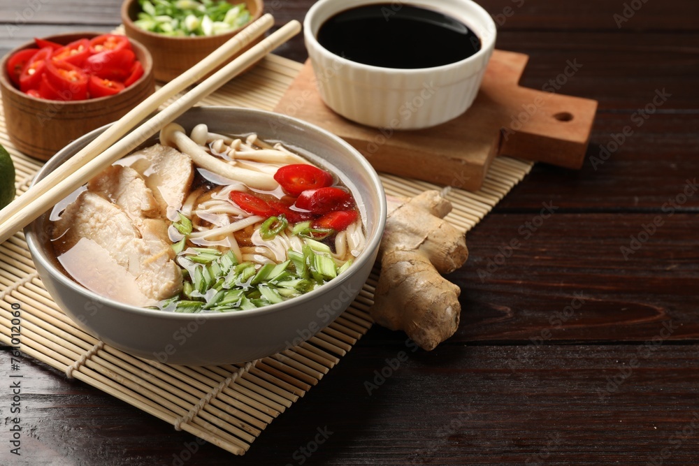 Delicious ramen with meat and ingredients on wooden table. Noodle soup Delicious ramen with meat and ingredients on wooden table. Noodle soup
